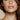 Close-up of a woman's face with a neutral background