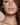 Close-up of a woman's face with a neutral background