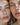 Close-up portrait of two individuals showcasing their facial features, potentially to highlight the results of cosmetic treatments Hyaluronic Acid filler