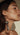 Close-up of a person holding a  facial vibrator during neck Botox in NYC